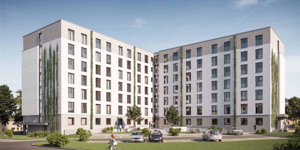 Modernes Studentenwohnheim Magdeburg mit begr&uuml;nten Fassaden, Parkpl&auml;tzen und Gr&uuml;nfl&auml;chen im Au&szlig;enbereich.