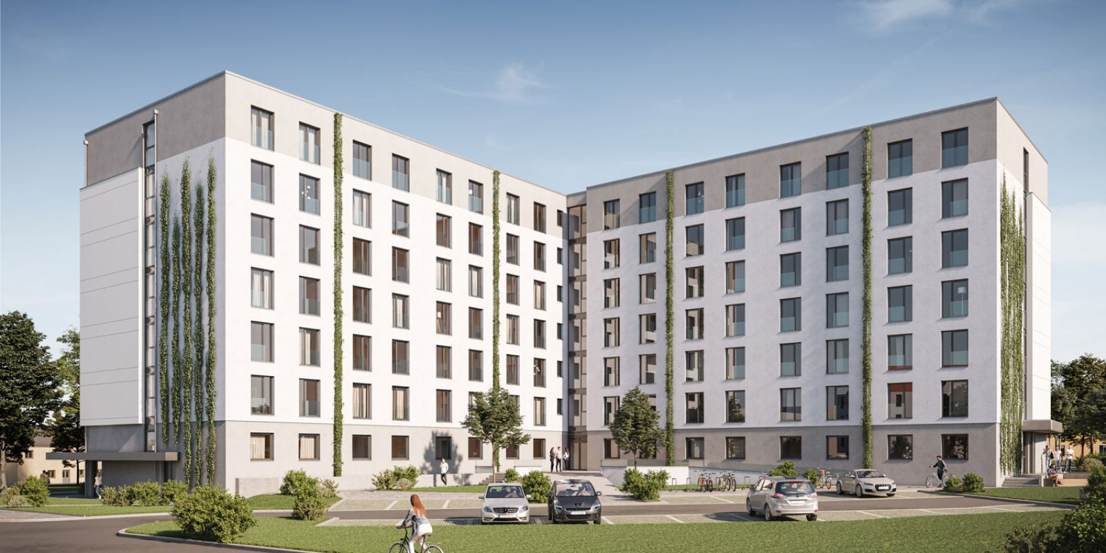 Modernes Studentenwohnheim Magdeburg mit begrünten Fassaden, Parkplätzen und Grünflächen im Außenbereich.